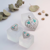 Graceful Heart-Shaped Pendant & Stud Earring Set with Crystal Floral Detailing