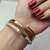 Stylish Crystal Nail-Inspired Gold-Tone Bangle – Elegant Designer Statement Jewellery for Women