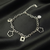 Sophisticated Silver-Toned Charm Bracelet – Contemporary Floral & Geometric Link Bracelet for Women